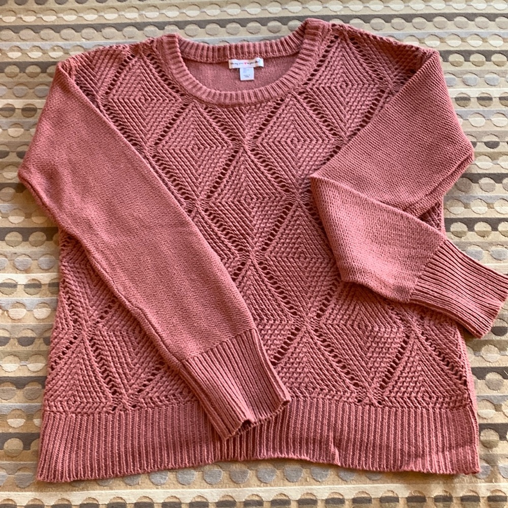 Terra Cotta in color. Loose weave, light weight with split hem, never worn.